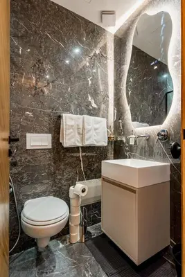 a bathroom with a sink and a toilet and a mirror at Quiet & Secure Apt - Fast WiFi - Central Area in Marrakech