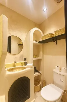a bathroom with a sink and a toilet at Riad chic Suite élégante au coeur de Marrakech in Marrakech