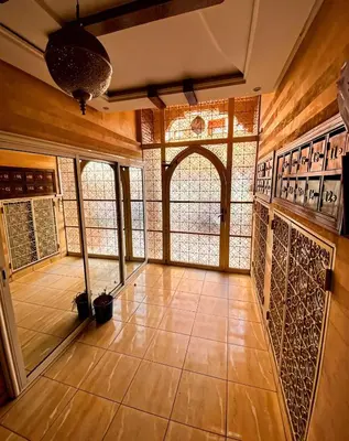 a room with stained glass windows and a tiled floor at Cozy apartment, traditional style, mountain view in Marrakech