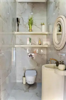 a bathroom with a toilet and a sink and a mirror at Luxury Villa Hedi in Marrakech
