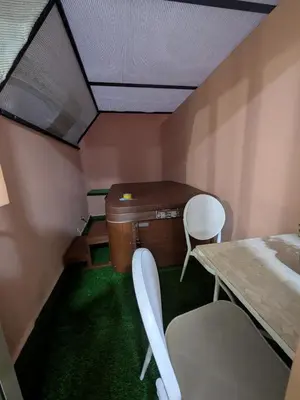 a room with two chairs and a table and a desk at Majorelle blue SPA retreat in Marrakech
