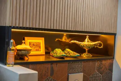 a shelf with some vases and a bowl on it at Eden Palmyra in Marrakech