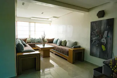 a living room with a couch and a table at The ApexYour skyward sanctuary in the city's heart in Marrakech