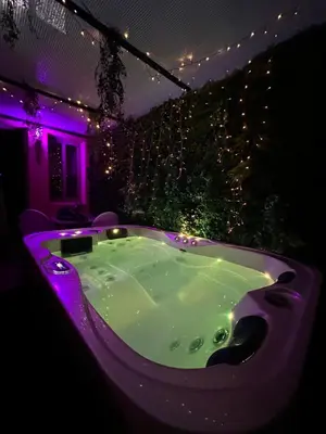 a bath tub in a room with purple lights at Majorelle green Spa Suite in Marrakech