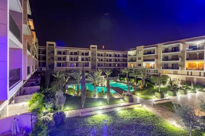 an aerial view of a hotel with a pool at night at Luxury Pool View Marrakech in Marrakech