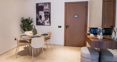 a dining room with a table and chairs and a kitchen at New Apartment in Gueliz with Private Terrace in Marrakech