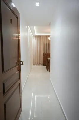 an empty hallway with a door and a room at The Skybox your private seat at the city s show in Marrakech
