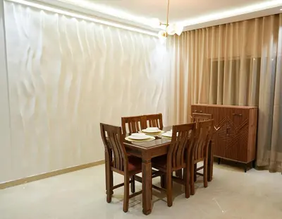 a dining room with a table and chairs at The Skybox your private seat at the city s show in Marrakech