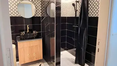 a bathroom with a shower and a sink and a mirror at A cozy escape in Marrakech in Marrakech