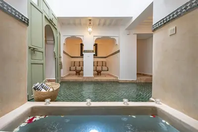 a pool of water in the middle of a building at Riad JewelBox Exclusive Stay In the Medina in Marrakech
