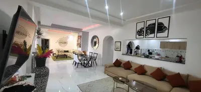 a living room with a couch and a table at Villa Riad Dar Sukar in Marrakech