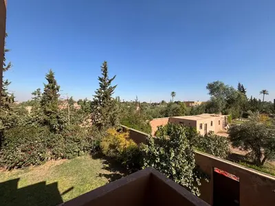 a view from the balcony of a house with trees at boulevard oued issil Palmeraie in Marrakech