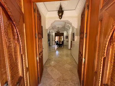 a hallway leading to a room with a hallway at boulevard oued issil Palmeraie in Marrakech