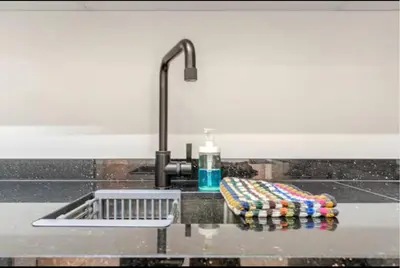 a kitchen counter with a sink and aaucet at Studio Nahellan in Marrakech