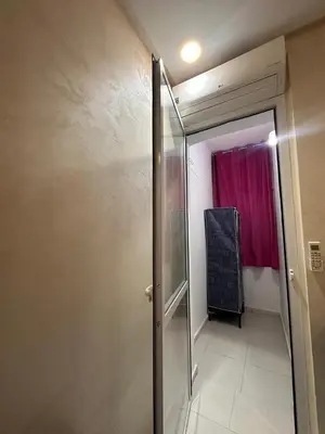 a bathroom with a shower and a red curtain at Aljawhara 2BD in Marrakech