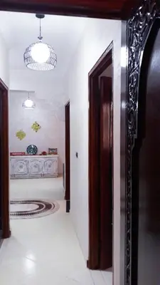 a hallway with an open door in a room at Beautiful apartment 5' from Macdonald, 10' from Downtown in Marrakech