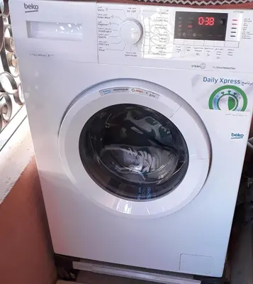 a washing machine with a washer in a room at Beautiful apartment 5' from Macdonald, 10' from Downtown in Marrakech