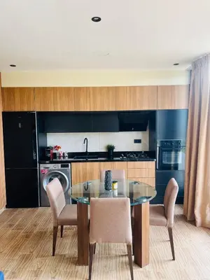 a kitchen with a glass table and chairs at Bungalow in Marrakech in Marrakech