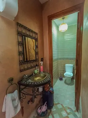 a bathroom with a sink and a toilet at Riad Dar Kenza in Marrakech