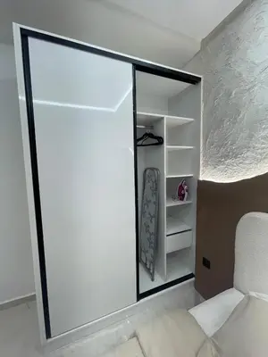 a room with a sliding glass door and a chair at Premium studio - Hivernage Marrakech in Marrakech