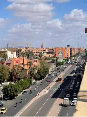a busy city street with cars and buildings at Premium studio - Hivernage Marrakech in Marrakech