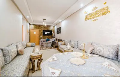 a living room with a couch and a table at Marrakech Chic apartment in Marrakech