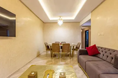 a living room with a couch and a table at Appartement moderne 5 min au centre ville in Marrakech