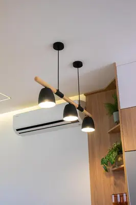 a ceiling light with four lights hanging from a ceiling at Appartement avec GOLF PISCINE Prestigia Jade in Marrakech