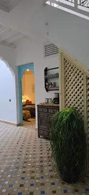 a room with a door and a table in a room at Riad Kasbah 82 in Marrakech