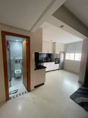 a large kitchen with a shower and a toilet at Résidence Al Aziziya Near Marrakech Airport in Marrakech