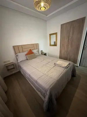 a bedroom with a large bed in a room at Le style a marrakech in Marrakech