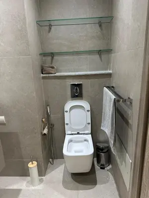 a bathroom with a white toilet in a stall at Le style a marrakech in Marrakech