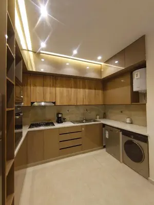 a kitchen with a sink and a dishwasher at Majorelle Apartment YSL in Marrakech
