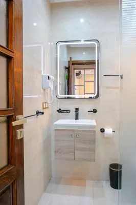 a bathroom with a sink and a mirror at The Soft Living - Marrakech Centre in Marrakech