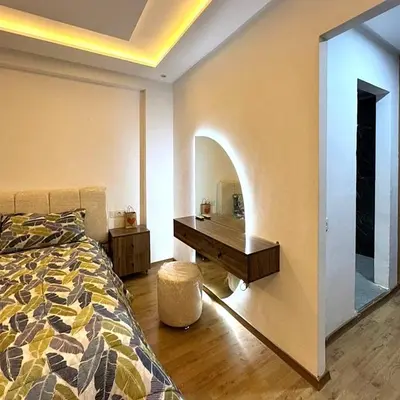 a bedroom with a bed and a desk in it at Friendly family home in a peaceful location in Marrakech