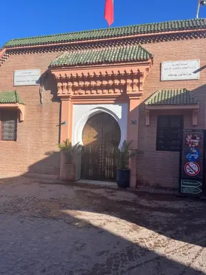 an entrance to a brick building with an arch at Riad traditionnel Kham's centre Marrakech in Marrakech