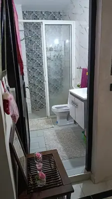 a bathroom with a shower and a toilet and a sink at Afaq marrakech in Marrakech