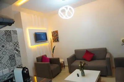 a living room with a couch and a table at Lovely Studio a gulez centre marrakech in Marrakech