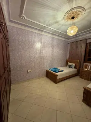 a bedroom with a bed and a ceiling at Comfortable stay - Marrakech style in Marrakech