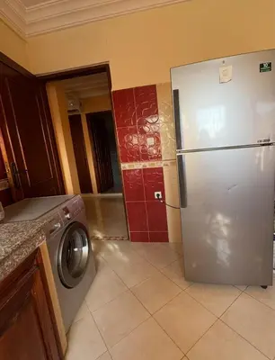 a kitchen with a stainless steel refrigerator in a kitchen at Comfortable stay - Marrakech style in Marrakech