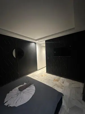 a bedroom with a bed with a pillow on it at le duplex spacieux comfort in Marrakech