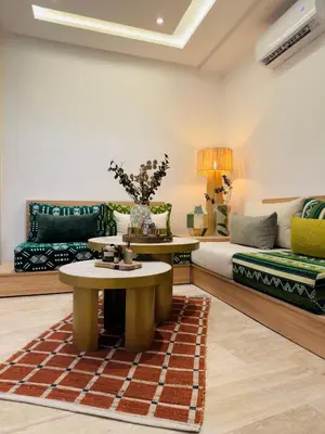 a living room with a couch and a table at RIAD El Ma in Marrakech