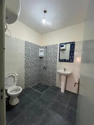 a bathroom with a toilet and a sink at 3Br in heart of Marrakech 15min from downtown in Marrakech