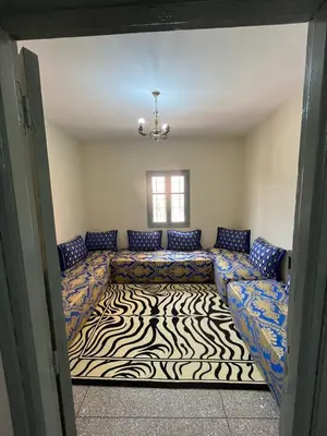 a living room with couches and a zebra rug at 3Br in heart of Marrakech 15min from downtown in Marrakech