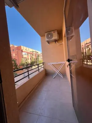 a balcony with a air conditioner on a building at Appartement moderne 5 min au centre de ville proche du gueliz in Marrakech