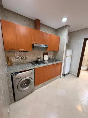 a kitchen with a washer and a washing machine at Kech in Marrakech