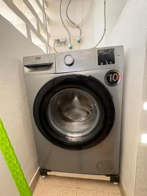 a washing machine in a corner of a room at A haven of light & sweetness in Marrakech