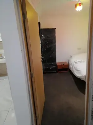 a room with a bed and a door to a bedroom at Dar Essalam in Marrakech