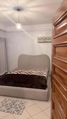 a bedroom with a bed in a room at 3 bedrooms 2 balconies kitchen, salon 2 bathrooms in Marrakech