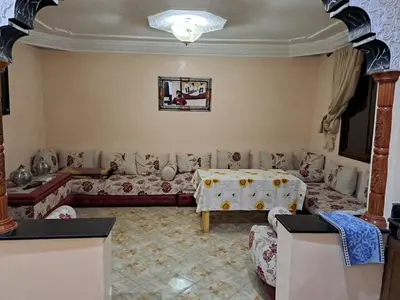 a living room with a couch and a table at Happy space in Marrakech